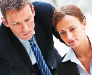 two people looking at Misclassifying employees case