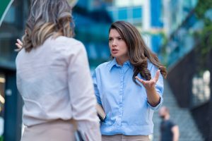 woman talking to another woman 