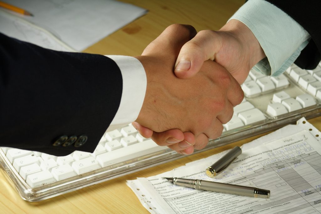 two lawyers shaking hands